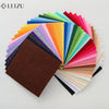 A fan of colorful non-woven felt fabric sheets displayed in a vibrant spectrum of colors.