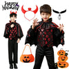 A boy dressed in a black vampire bat costume with a cape, shirt, pants, and accessories for Halloween.