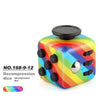 Rainbow-colored decompression die cube with a black top and multiple buttons