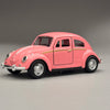 A pink classic retro Beetle diecast model car with gold trim, shown in a side profile.
