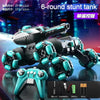 A black and teal transformable RC stunt tank is shown with its remote control and accessories.