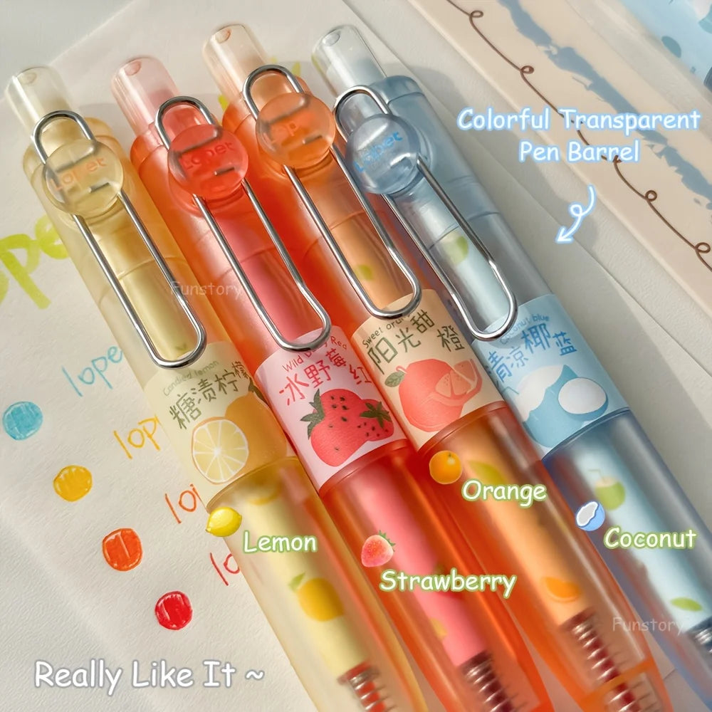 A set of four colorful transparent pen barrels filled with fruit scents like Lemon, Strawberry, Orange, and Coconut.