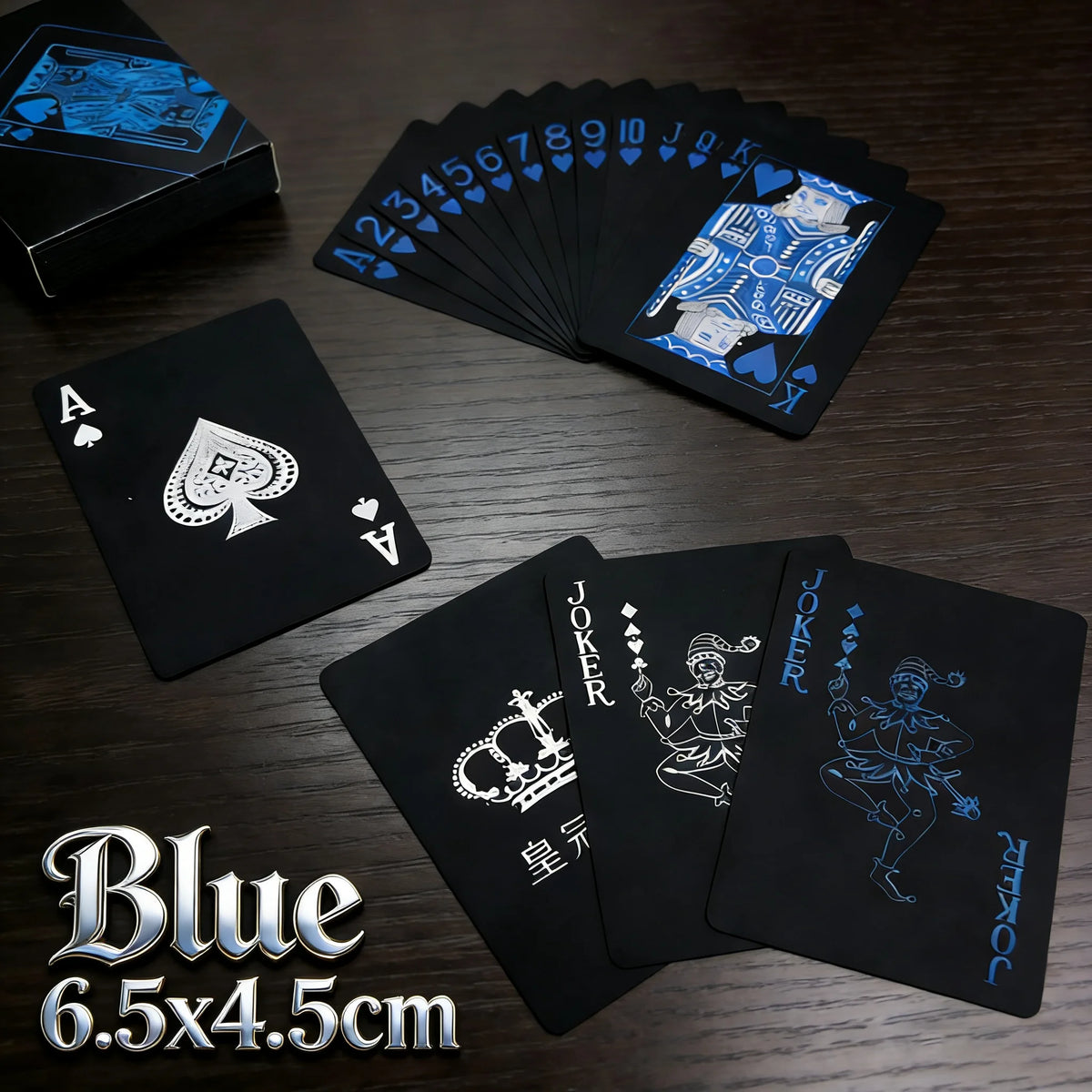A set of blue playing cards and a joker card displayed on a dark wooden surface.