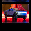 A silver and blue high-speed off-road RC cyber truck with large tires and illuminated features.