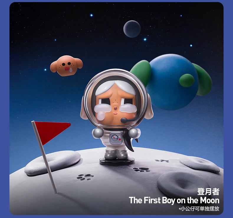 A collectible figurine of a boy in a spacesuit floating near the moon with a red flag.