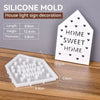 A white silicone mold for a house light sign decoration featuring heart-shaped cutouts.