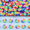A collection of colorful polymer clay smiling sunflower beads for jewelry making