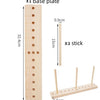 A wooden base plate with holes and three wooden sticks for making ribbon bows.
