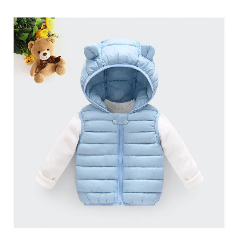 A light blue hooded cotton vest worn over a white long-sleeved shirt.