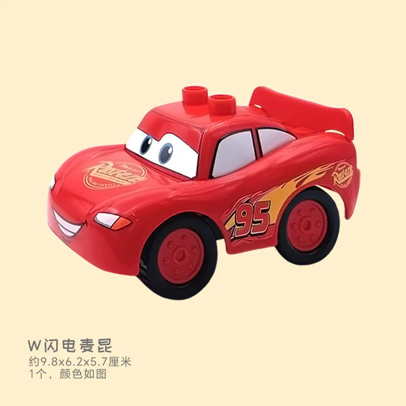 A red die-cast toy car resembling a cartoon character is shown against a light background.