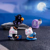 A set of charming cartoon pumpkin bear figurines in various colors displayed against a blue moon background.