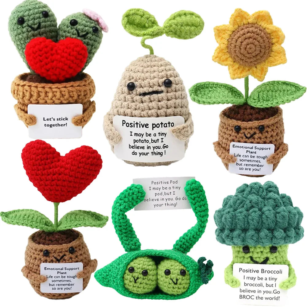 Handmade crochet positive alien pocket hug gift featuring various stuffed green and red creatures.