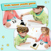 A child is playing a brain teaser puzzle game with blocks and a storage case on a white table.