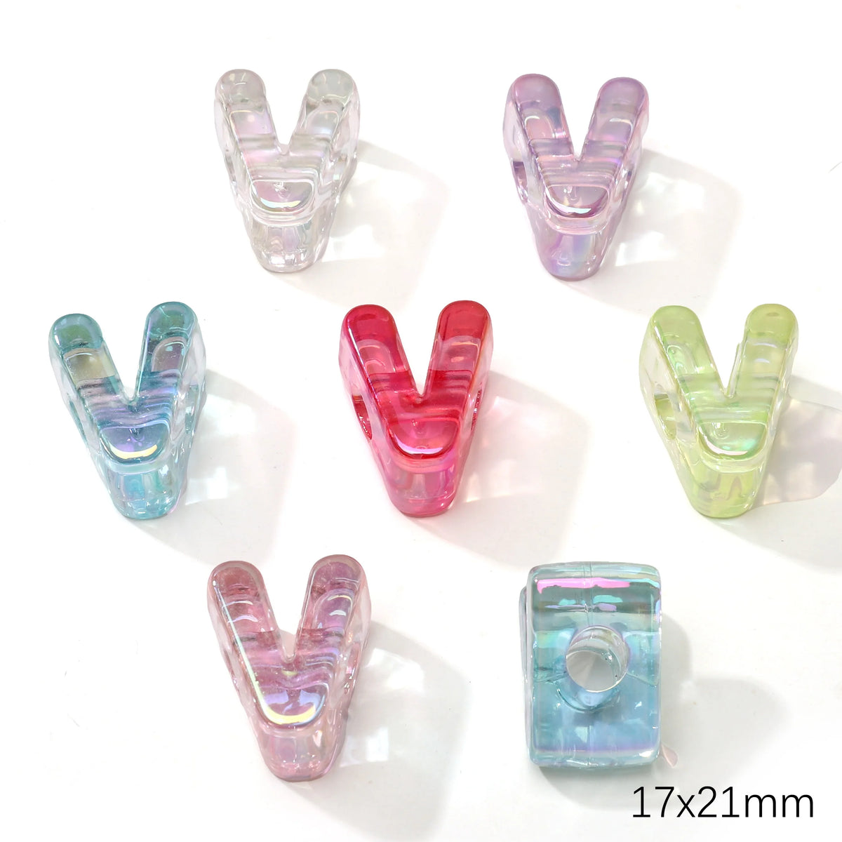 A collection of colorful acrylic letter V beads in various shades including purple, pink, green, and blue.