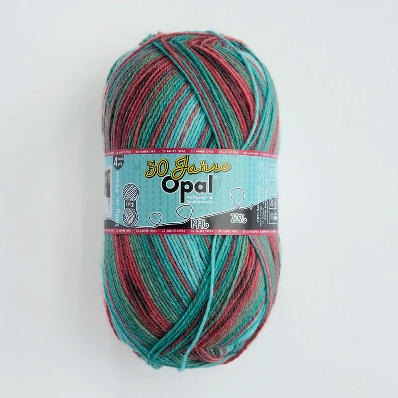 A ball of Opal 4-ply sock yarn in a blend of teal, red, and green fibers.