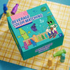 A box of Beverage Color Matching game featuring plastic bottles and matching liquid colors on a yellow mat.