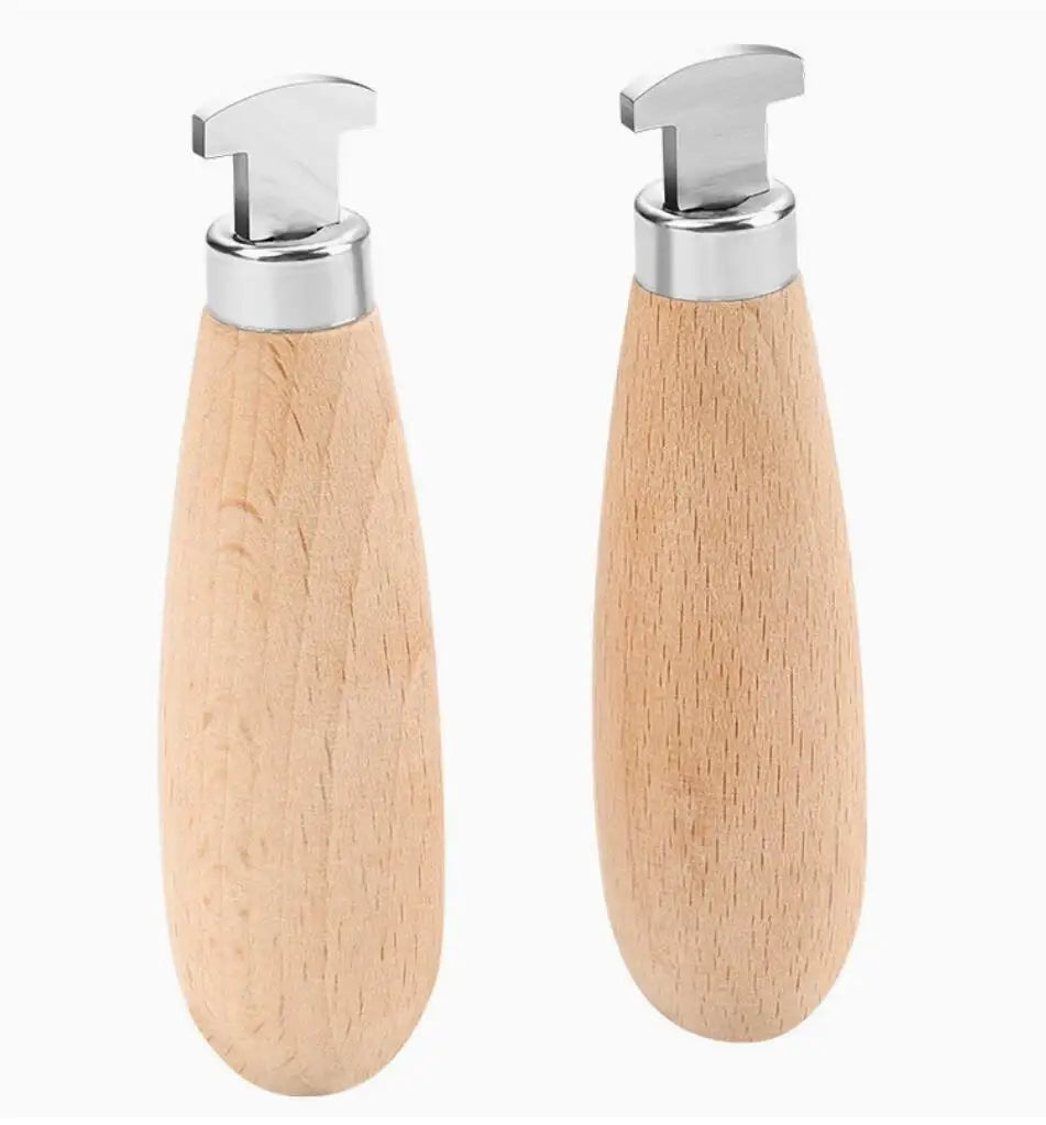 A professional bezel setting pusher tool with a silver handle and wooden grip.