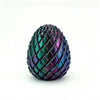 A close-up of a dark green and purple dragon egg fidget spinner with a textured, scale-like surface.