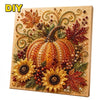A DIY painting kit featuring an autumn pumpkin design with gold and reddish-brown leaves and berries.