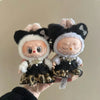 A pair of plush dolls dressed in leopard print sling dresses
