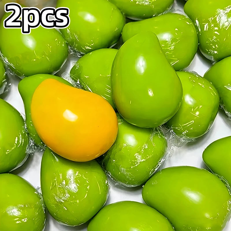 A collection of bright green and yellow color-changing mango squishy stress balls.