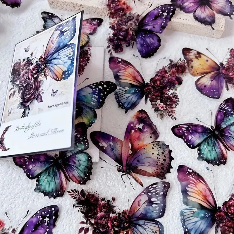 A collection of colorful butterfly stickers featuring purple, blue, and iridescent wings on a white background.
