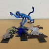 A blue Ben 10 Omnitrix Projector Watch toy figure in a dynamic pose.