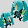 A pair of teal-colored Hatsune Miku plush dolls with long hair and accessories.