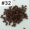 A pile of #32 brown fuse beads for creative craft projects.