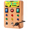 A wooden busy board with a dinosaur theme and various light-up buttons for toddlers.