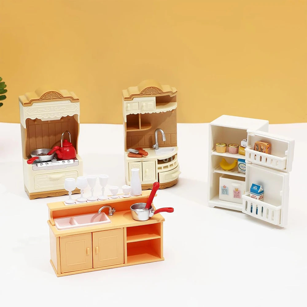 A dollhouse furniture playset featuring a mini kitchen with pots and pans and a small living room area.