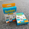 Two orange and blue boxes of Numbers 0-100 pocket flash cards showing numbers like thirty, fifty-one, six, and six.