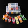 A collection of clear plastic storage bottles filled with various colored beads and glitter for crafting projects