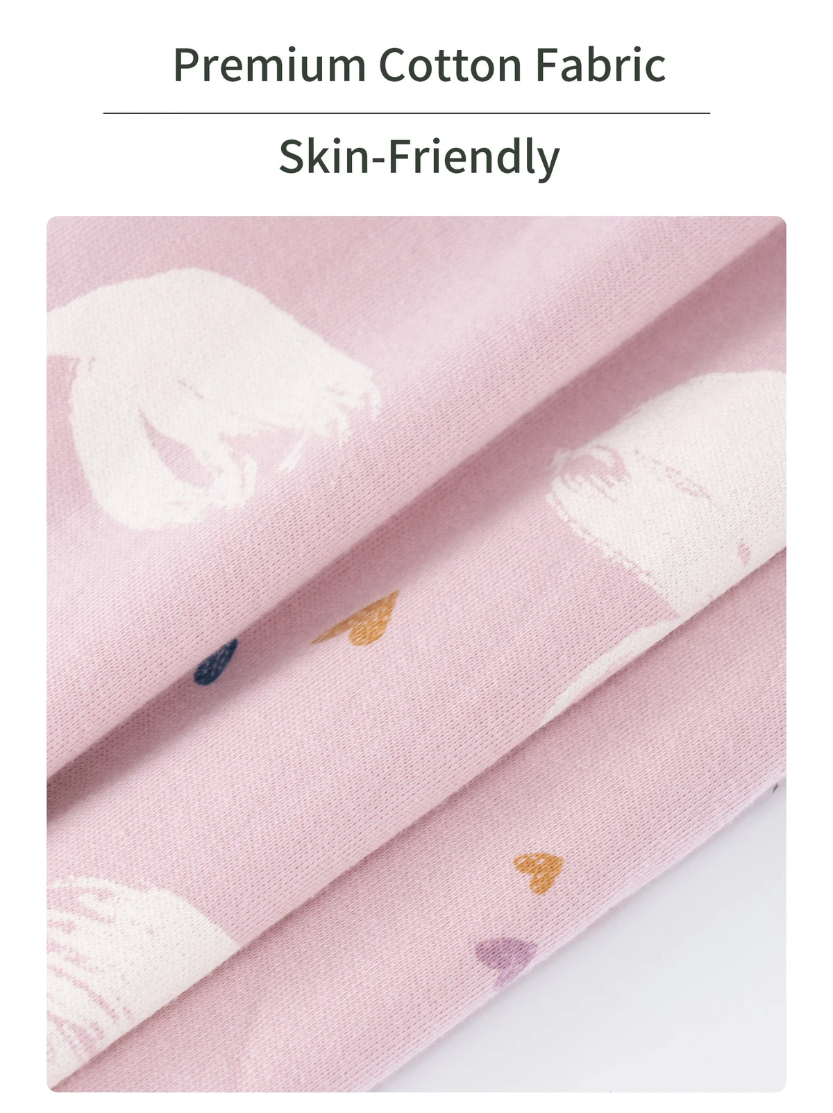 Pink cotton fabric with white floral print folded to show texture and softness