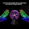 A hand is touching a glowing plasma ball lamp, causing dynamic light changes and visual effects.