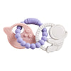 A set of food-grade silicone planet teethers for babies in purple and white colors.