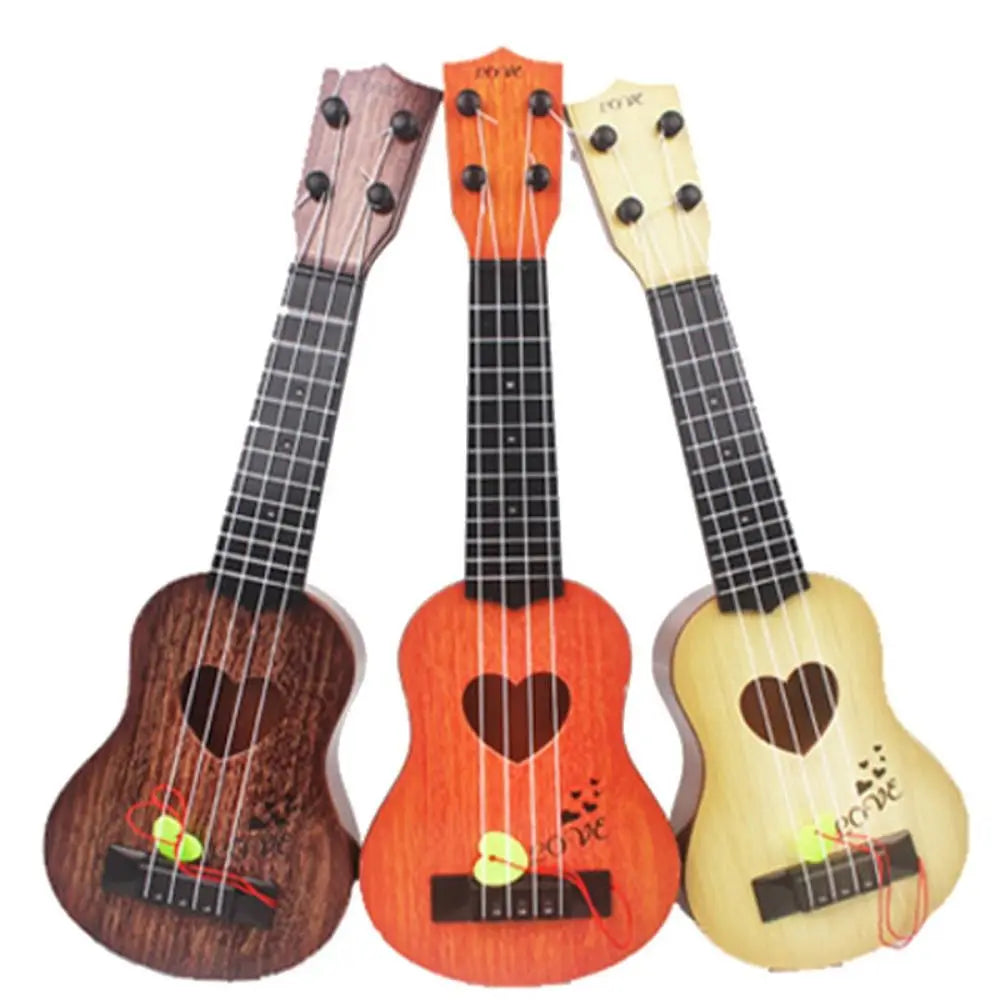 Three wooden ukulele toys in brown orange and yellow with adjustable tuning pegs