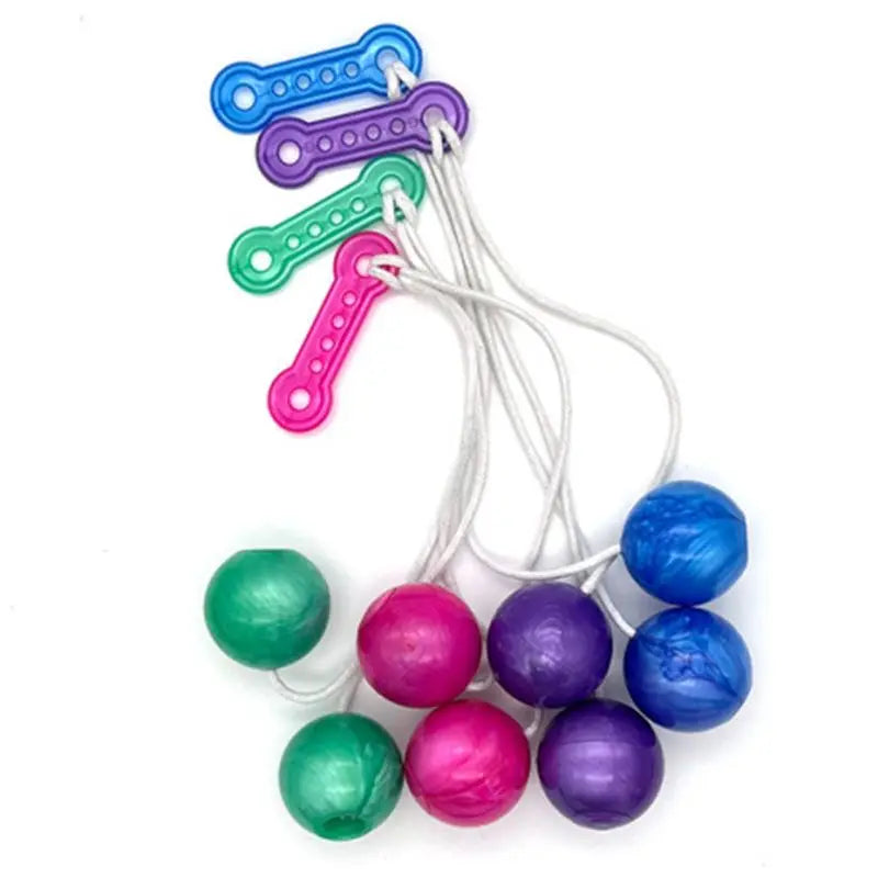 A collection of colorful click clack stress relief fidget balls strung together on a white cord.