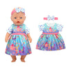A baby doll wearing a colorful floral dress and a matching bow accessory.