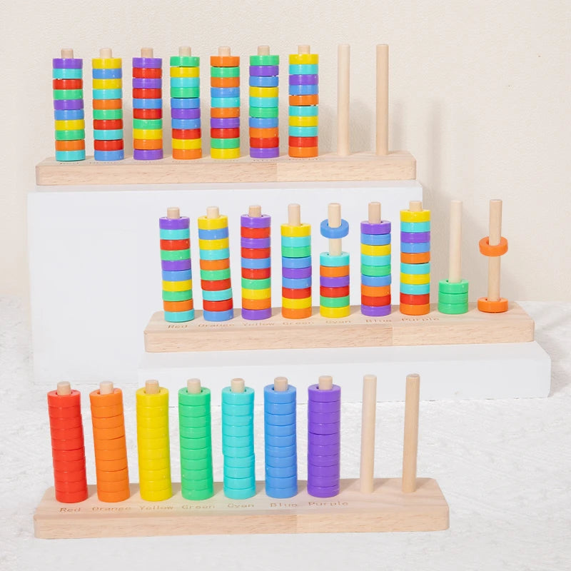 A wooden ring toss game for kids featuring colorful stacking rings in various colors like red, orange, yellow, green, blue, a
