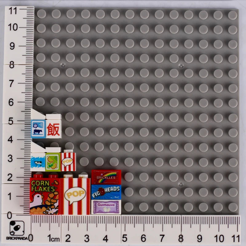 A set of mini supermarket and food building blocks featuring bricks like pizza, cake, and condiment items.