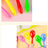 A collection of colorful mini maracas shaker toys in various bright colors like yellow, red, pink, and green.