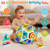 A toddler is playing with a colorful 22-in-1 Montessori activity cube featuring various sensory and cognitive skills.