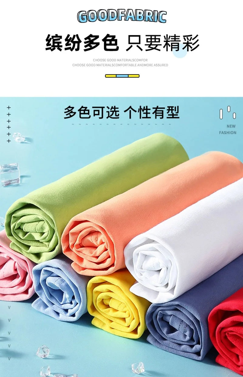 A variety of rolled fabric swatches in pastel and bright colors, including green, orange, pink, blue, yellow, and white.