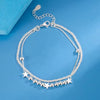 Elegant sterling silver snake chain bracelet for women displayed on a blue background