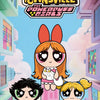 A collectible figure of Blossom from The Powerpuff Girls standing on a building facade.