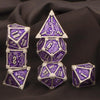 A set of seven polyhedral metal dice in purple and silver, including a d10, d12, d20, and others.