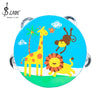 A blue wooden tambourine with a yellow giraffe, monkey, and lion cartoon design.