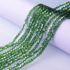 Green and clear faceted glass crystal beads strung together for jewelry making