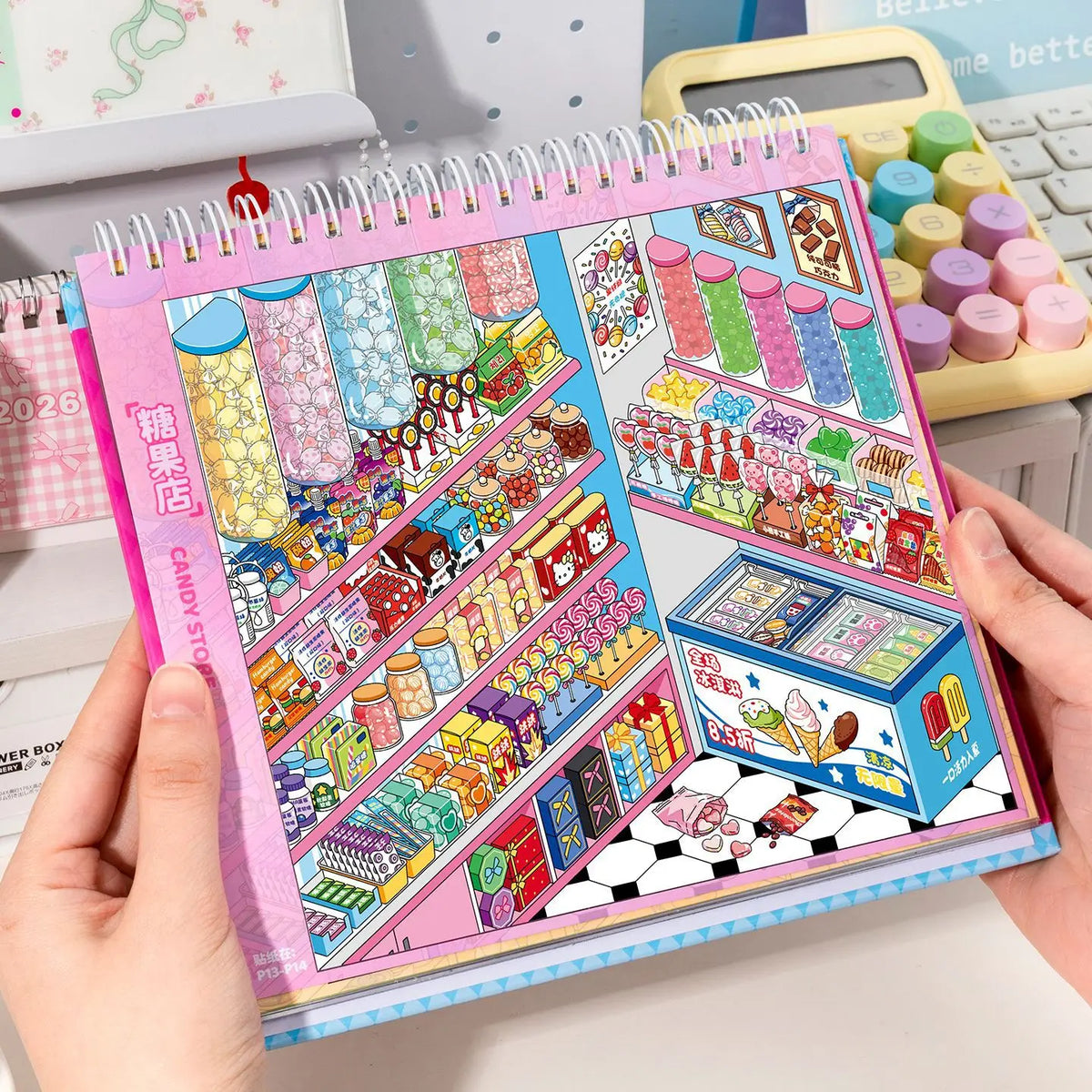 A pink and purple sticker book filled with 3D kawaii miniature scenes featuring various candies and food items for scrapbooki